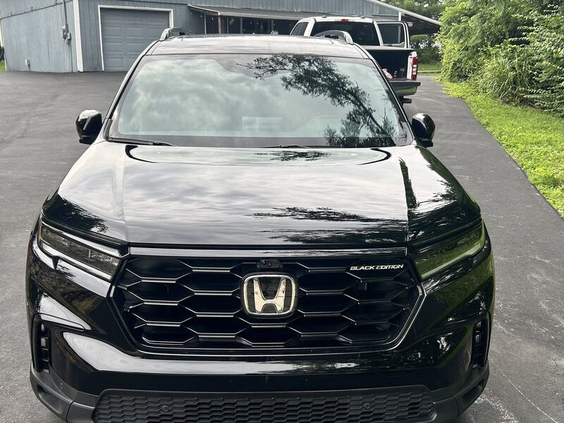 Black Honda Pilot Black Edition after a full detail, hood polished to a mirror finish